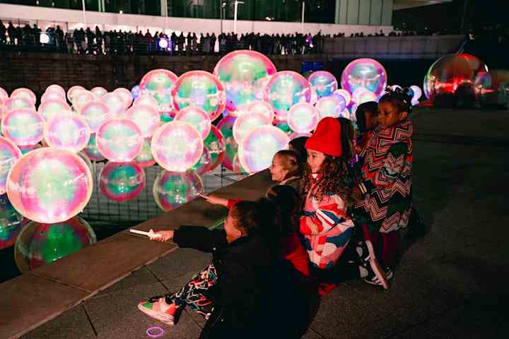 Youngsters enjoying a River of Light installation in 2024