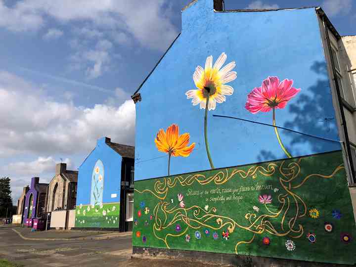 Flower mural on gable end of a house