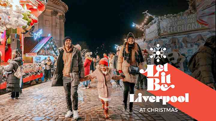 three people walking at Liverpool Christmas Market