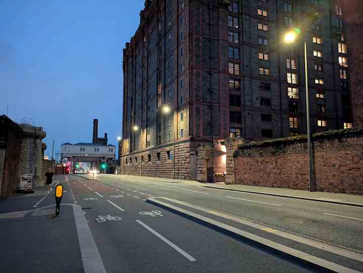 A road in the evening, with streetlights turned on