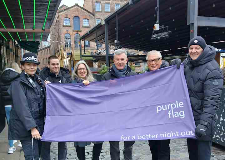 Partners from across Liverpool holding the Purple Flag