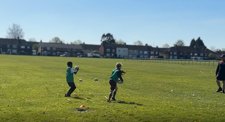 Children playing rugby