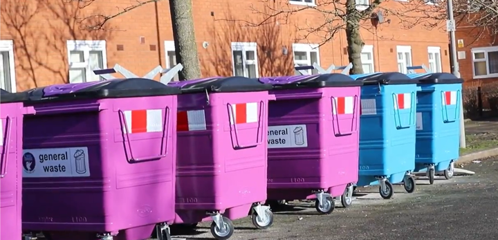 A group of large bins coloured purple and blue
