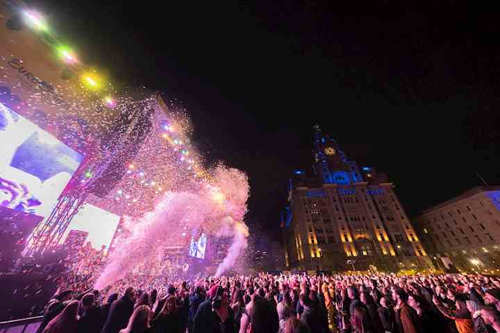 Crowds at night on the Pier Head with confetti cannons